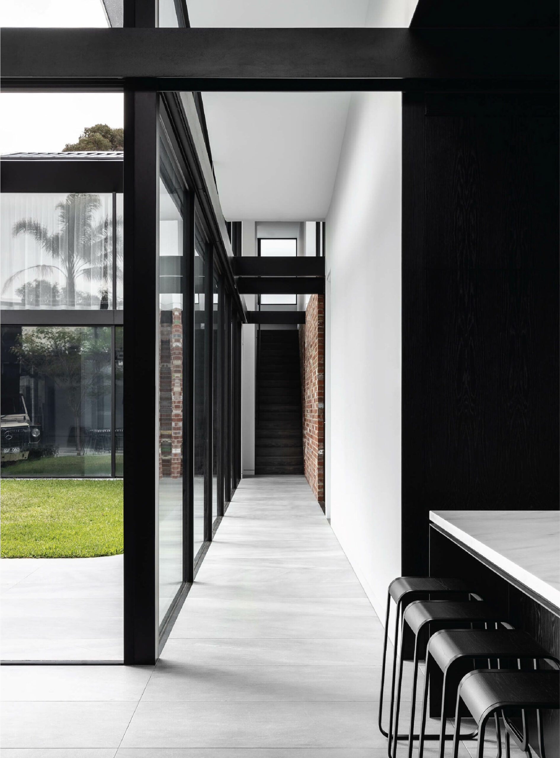 Prime Building Surveyors St Kilda Residence interior of dining area looking out onto exterior entertaining area 